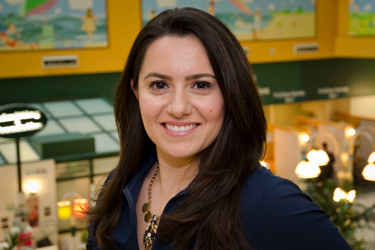 Portrait of a smiling woman with long brown hair