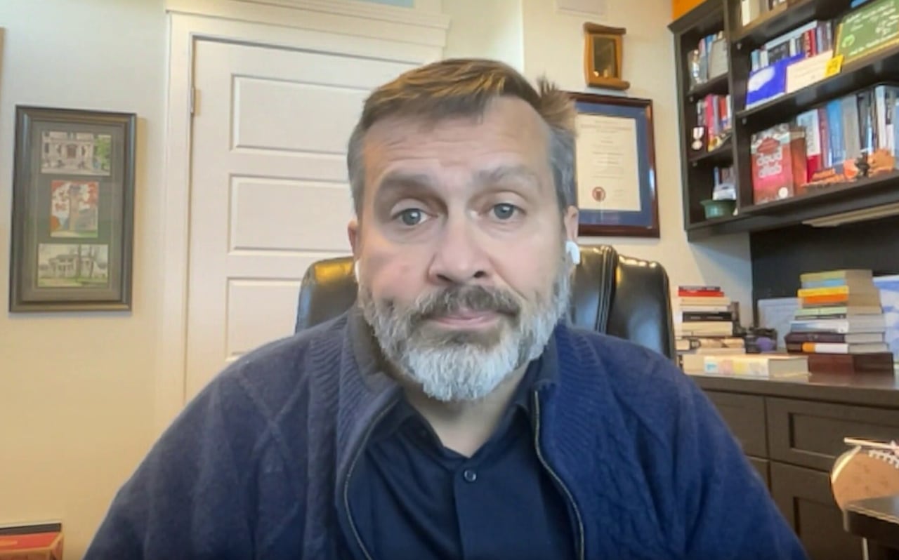 A man sits in an office.