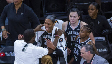 Aces center A'ja Wilson (22) shares a moment with Usher as he congratulates the team on an ...