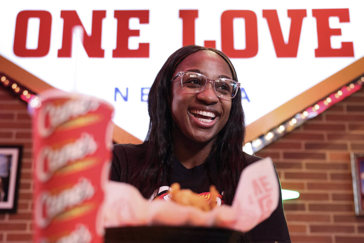Aces guard Jackie Young interacts with the media at Raising Cane’s on the Strip Tuesday, ...