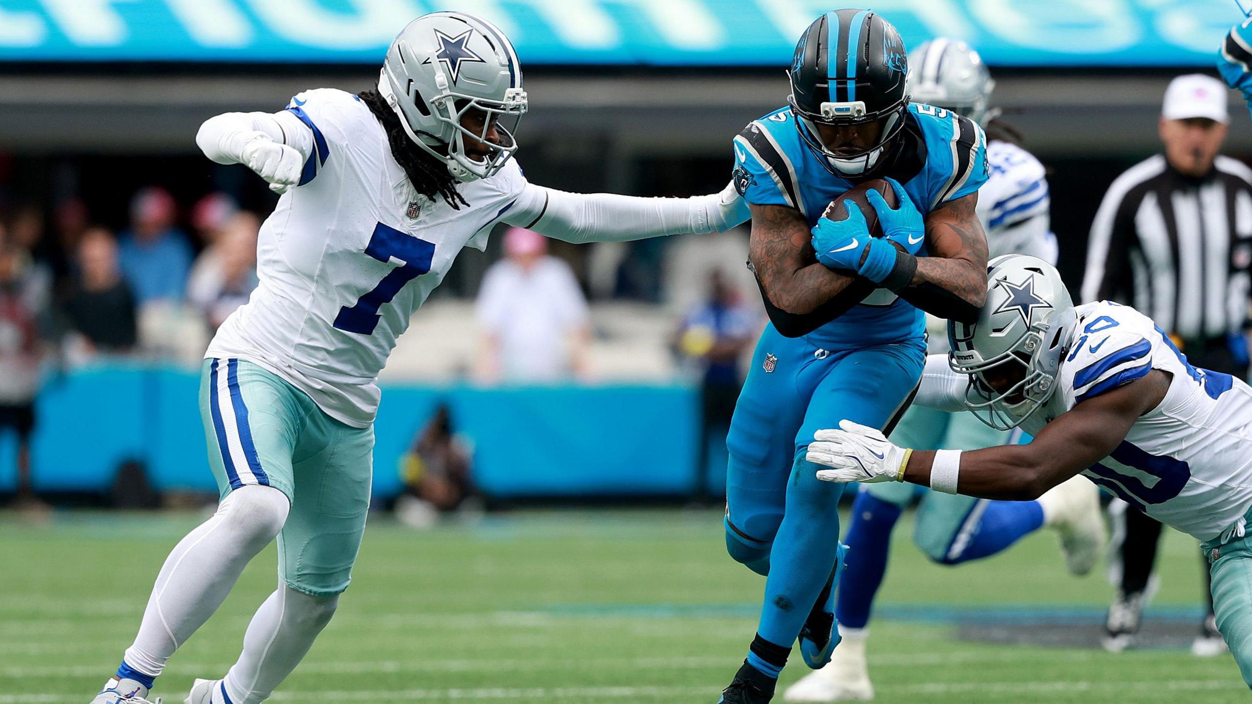 Rico Dowdle runs with the ball for the Carolina Panthers in their victory over the Dallas Cowboys in the NFL on Sunday