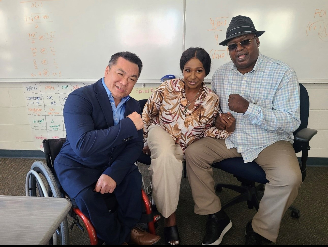 Orange County Superintendent Dr. Stefan Bean meets former heavyweight boxing champion James "Buster" Douglas and his wife, Bertha Douglas, during their visit to OCDE