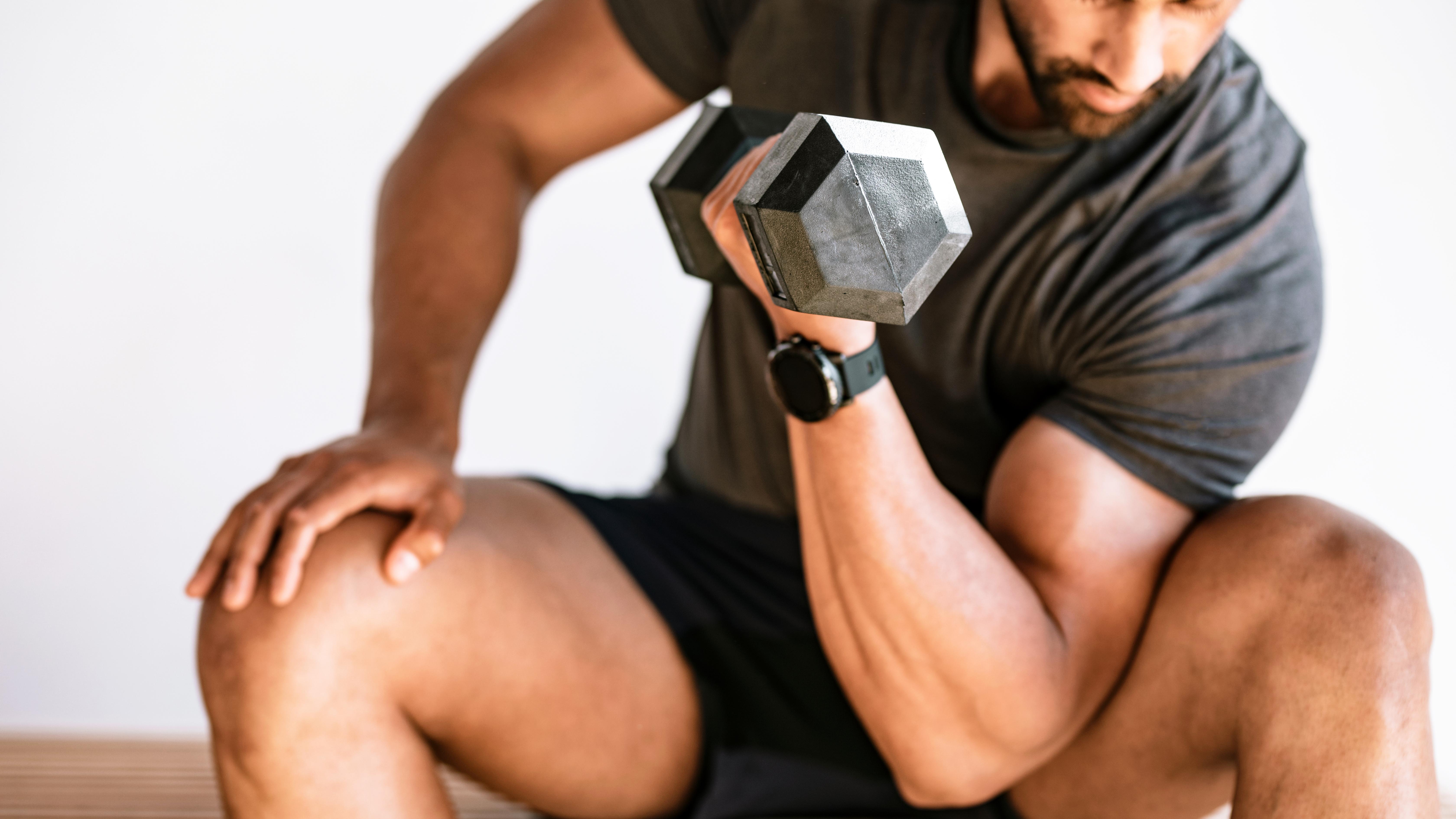 a man holding a dumbbell