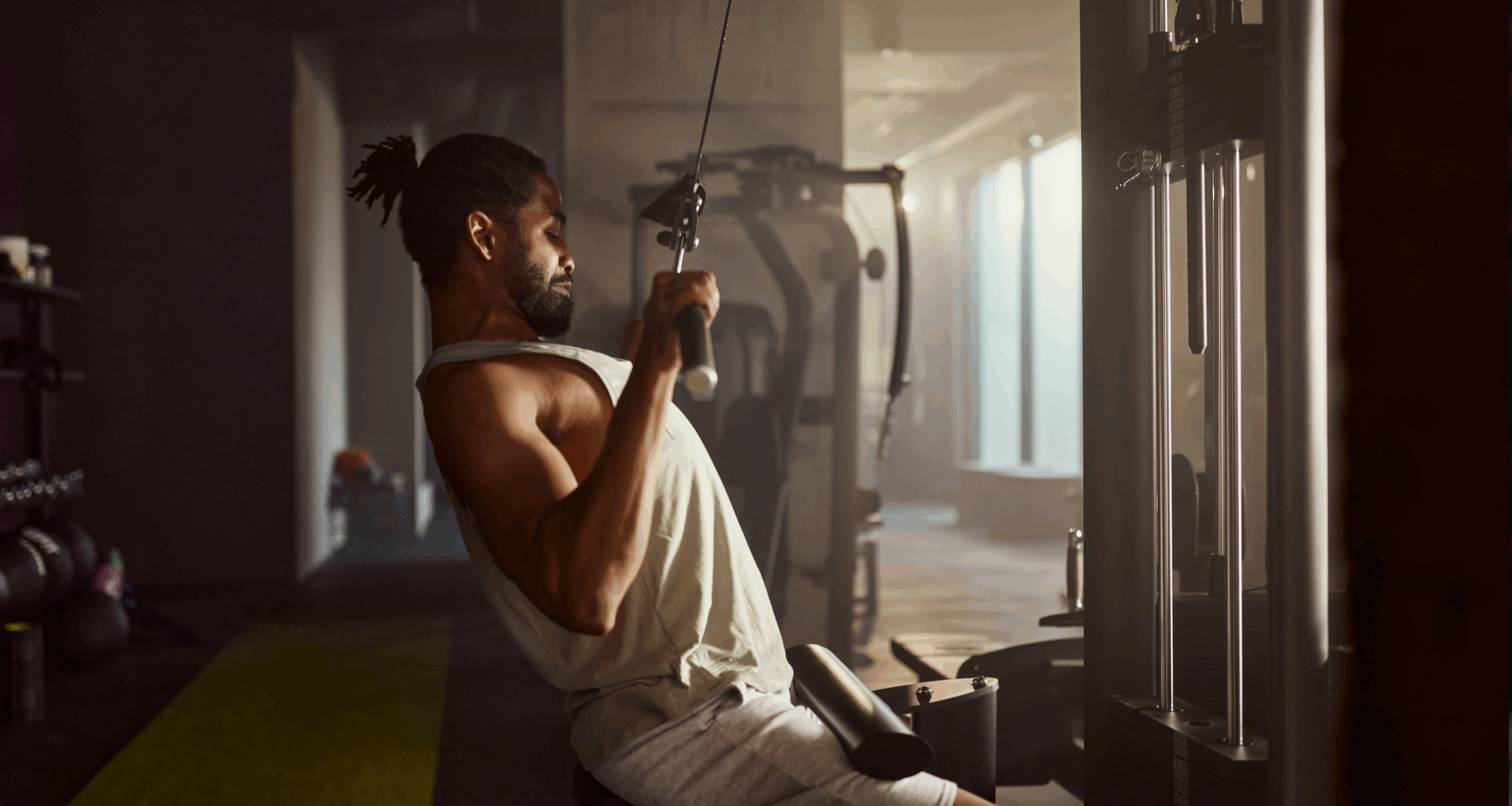 A man performing a lat pulldown