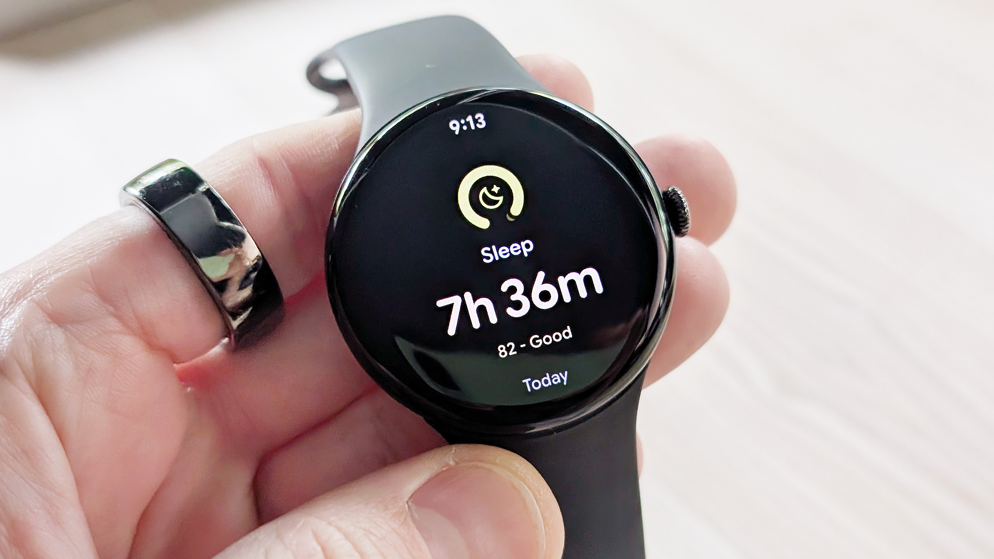 Close-up of the Google Pixel Watch 4 in black on a black strap