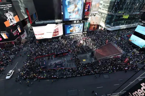 Getty Images An aerial shot of Times Square shows large crowds of protestors 