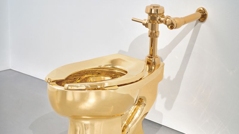 The artist Maurizio Cattelan’s infamous gold toilet is back — with a twist