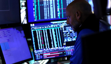 A trader works on the floor of the New York Stock Exchange (NYSE) at the opening bell on October 1, 2025, in New York City. Wall Street stocks mostly fell early Wednesday as the US government officially entered a partial shutdown following a stalemate in budget talks. (Photo by TIMOTHY A. CLARY / AFP)
