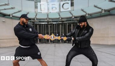 Frazer Clarke and Jeamie TKV play tug of war with the British heavyweight title