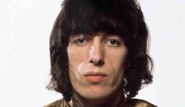 Rolling Stones bassist Bill Wyman posing for a photograph in 1969