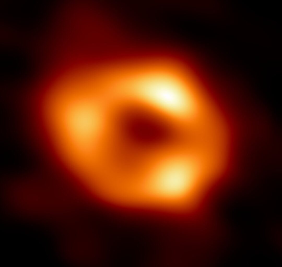 This is the first image of Sgr A*, the supermassive black hole at the centre of our Galaxy. Astronomers now think its possible for galactic black holes to evolve as binary pairs (Credit : EHT Collaboration)