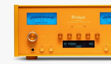 Orange McIntosh MA8950 integrated amplifier with blue power output meters and digital display showing