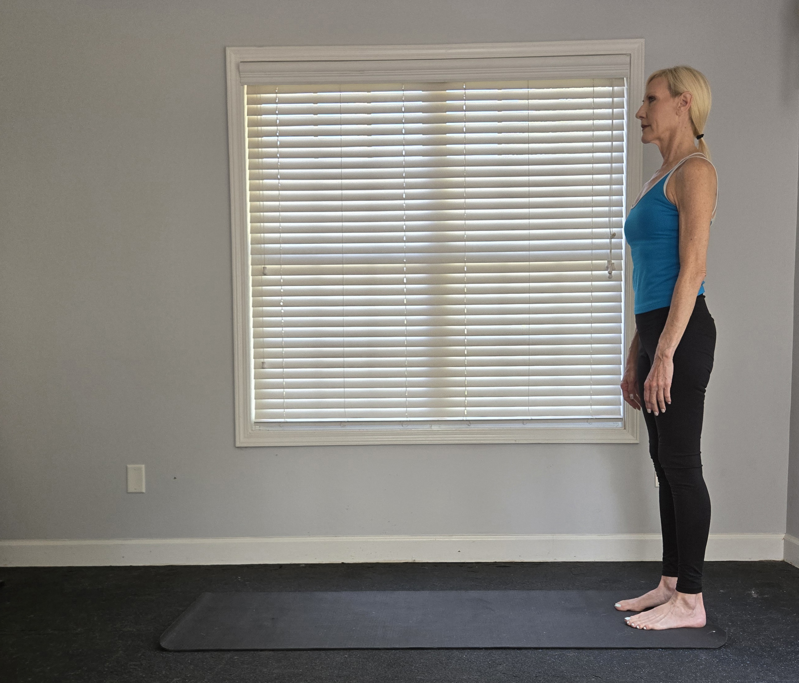 Woman demonstrating a position of the Pilates push-up