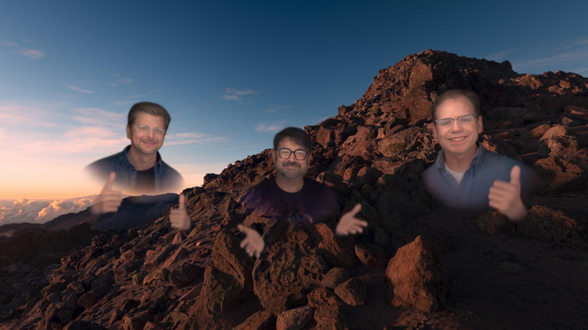 CNET's Scott Stein as a virtual Persona avatar in Apple's Vision OS, hovering in a volcanic canyon with Apple's Jeff Norris and Steve Sinclair.