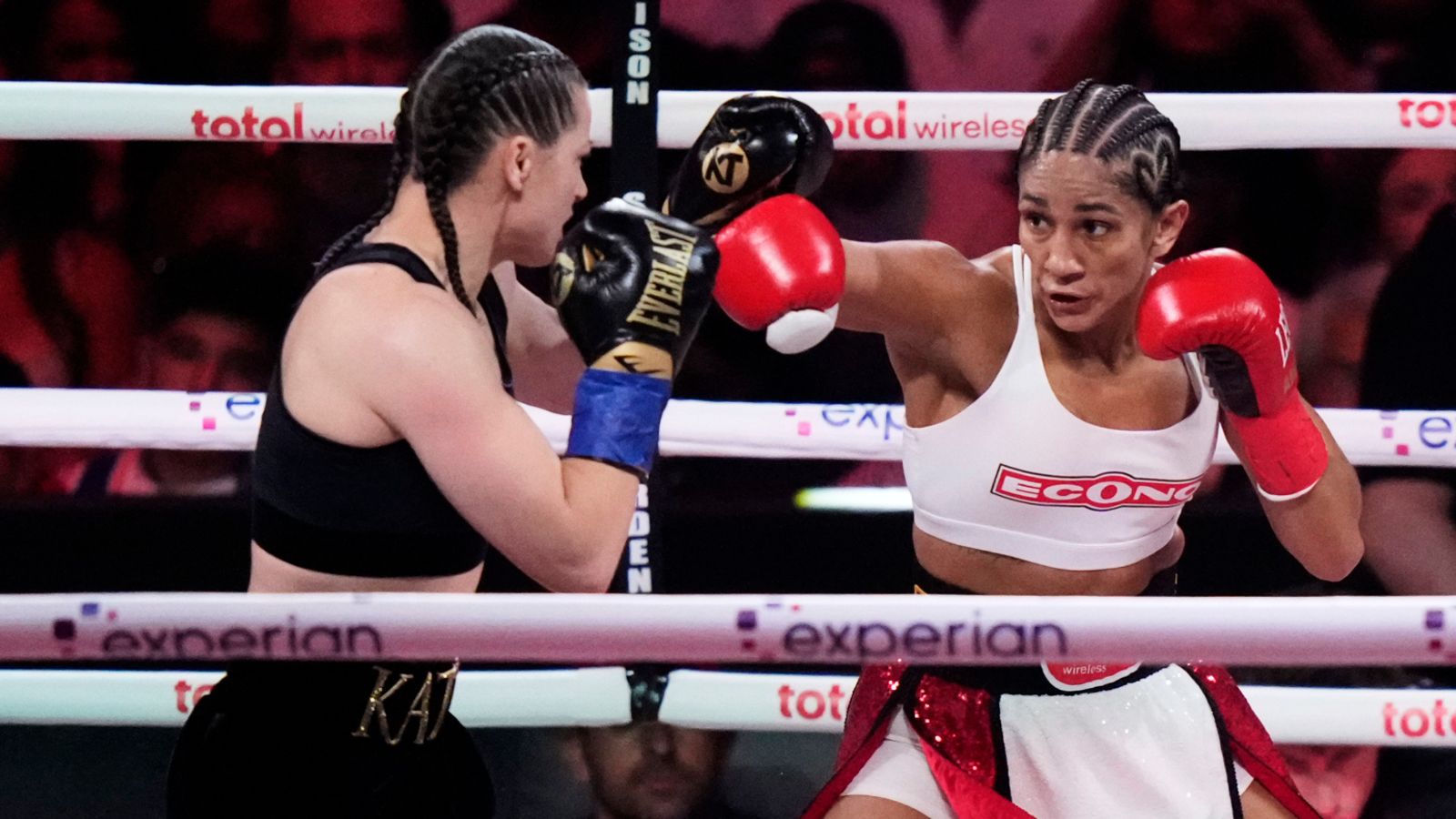 Puerto Rico's Amanda Serrano, right, punches Ireland's Katie Taylor during the second round of a super lightweight championship boxing match Friday, July 11, 2025, in New York. (AP Photo/Frank Franklin II)