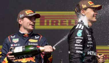 Mercedes driver George Russell, of the United Kingdom, right, is sprayed with champagne by second place Red Bull Racing driver Max Verstappen, of the Netherlands, after winning Formula One auto racing at the Canadian Grand Prix in Montreal, Sunday, June 15, 2025. (Christinne Muschi/The Canadian Press via AP)