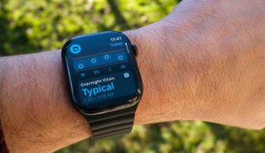 An Apple Watch on a wrist. The screen shows the Vitals app.