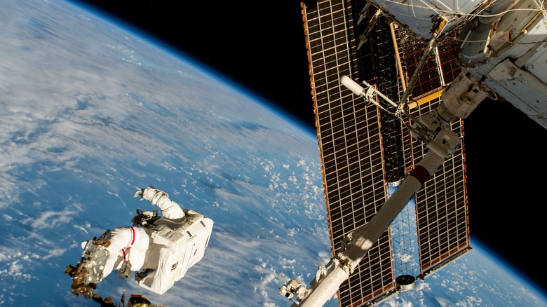 Astronaut performing spacewalk outside the ISS