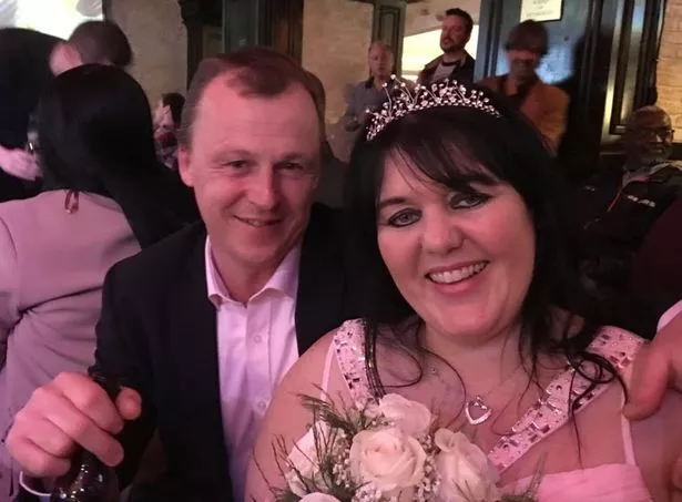 Lisa with her husband, Gary, on their wedding day (Jam Press)