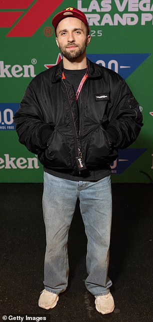 French YouTuber Squeezie, 29, (pictured) and actor Tyler Hoechlin, 38, both dressed down for the sporting occasion in oversized jackets, baggy pants and white trainers