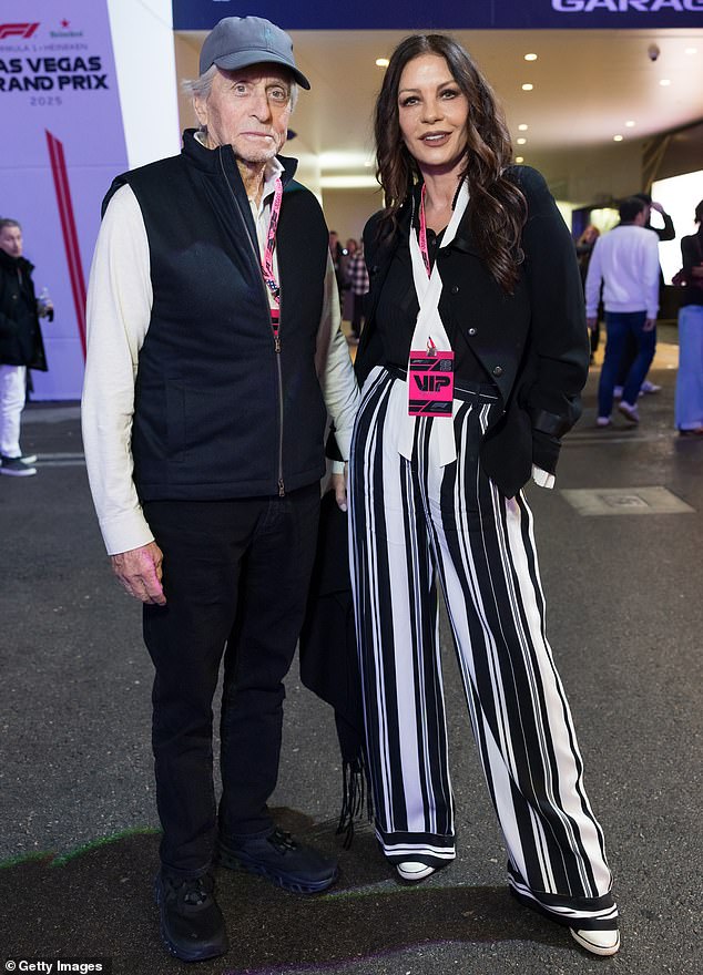 Catherine Zeta-Jones, 56, and husband Michael Douglas, 81, twinned in chic monochrome ensembles as the Wednesday actress opted to elongate her legs with bold striped trousers