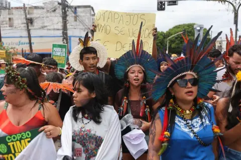 Reuters Protesters at a march in Belem, Brazil, near the COP30 climate summit. 