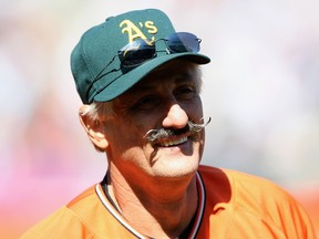 Hall of Famer Rollie Fingers participates in a celebrity softball game in 2007.