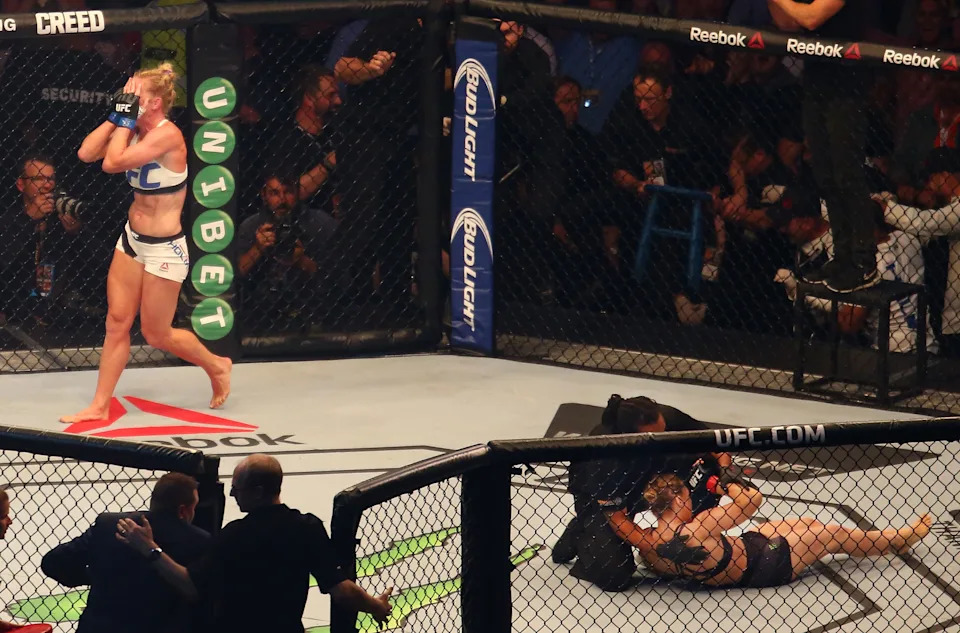 MELBOURNE, AUSTRALIA - NOVEMBER 15:  New UFC women's bantamweight champion Holly Holm of the United States celebrates her victory over Ronda Rousey of the United States in their UFC women's bantamweight championship bout during the UFC 193 event at Etihad Stadium on November 15, 2015 in Melbourne, Australia.  (Photo by Scott Barbour /Zuffa LLC/Zuffa LLC via Getty Images)
