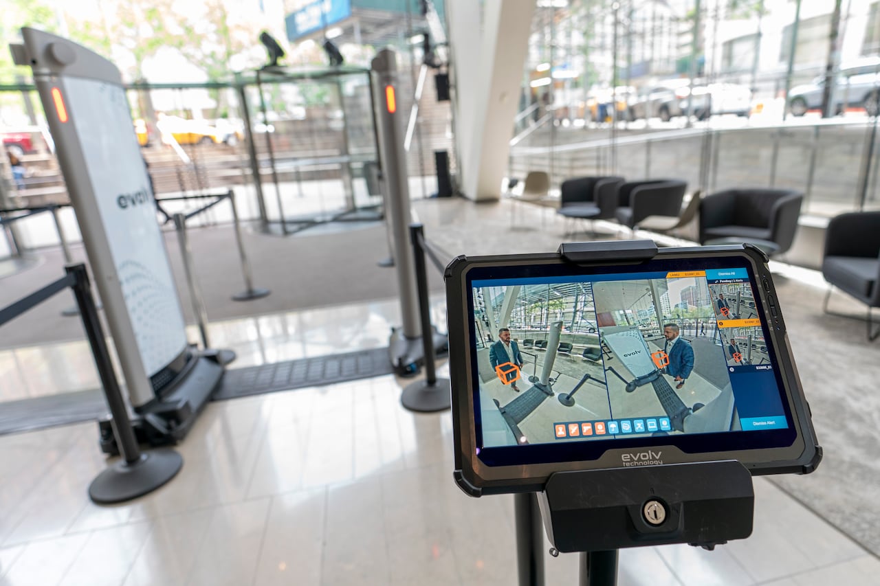 A computer screen shows a person.