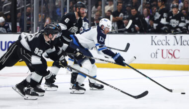 Winnipeg Jets centre Gabriel Vilardi (13) battles for the puck against Los Angeles Kings defenseman Brandt Clarke (92), left wing Jeff Malott, second from left, and defenseman Joel Edmundson (6) during the third period of an NHL hockey game, Tuesday, Nov. 4, 2025, in Los Angeles. (Jessie Alcheh / The Associated Press)