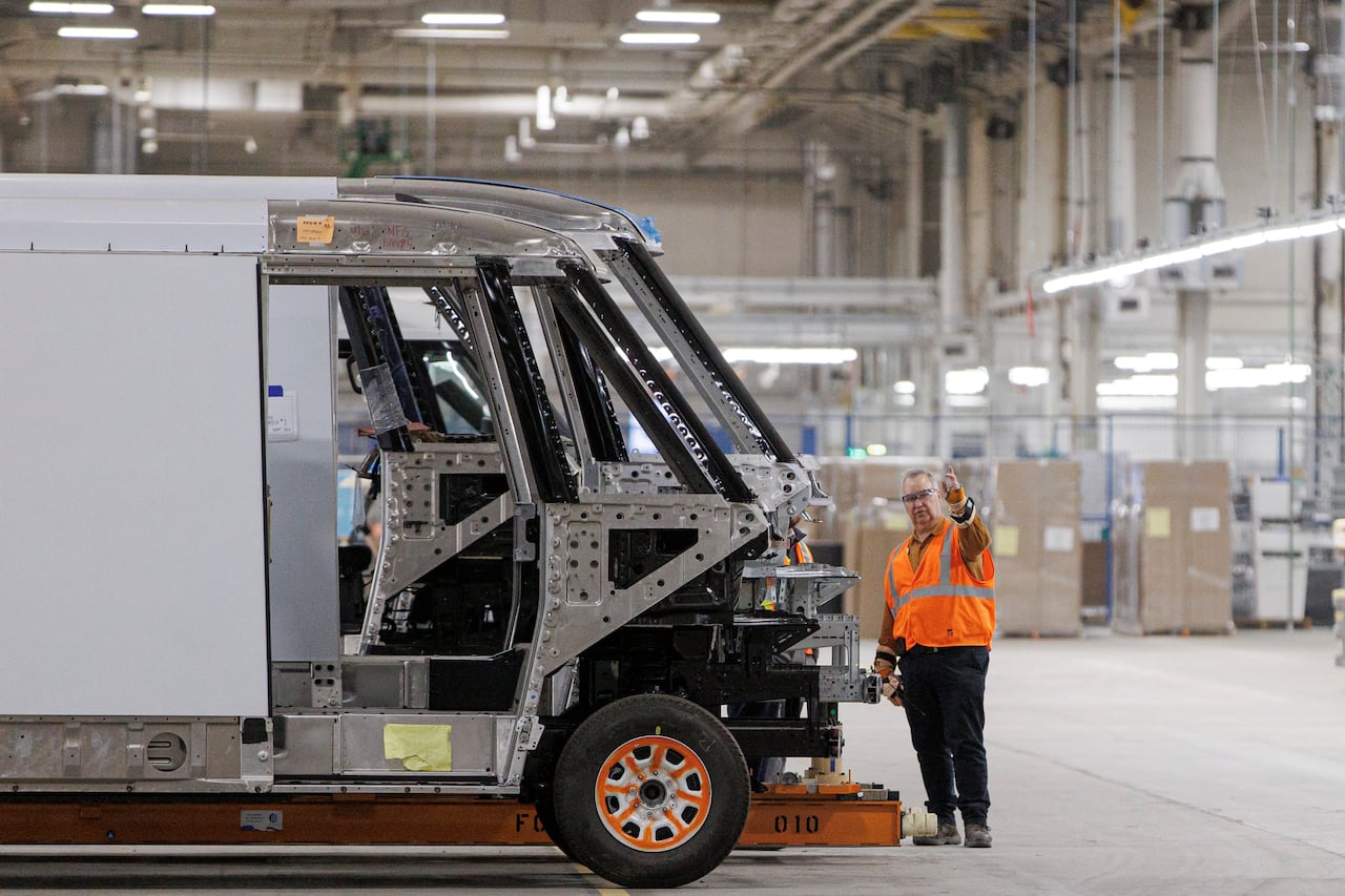 Workers assemble the components of a BrightDrop delivery van at General Motors’s CAMI EV plant, in Ingersoll, Ont., on Nov. 29, 2022.