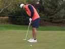 Toronto Blue Jays' Ernie Clement sinks a putt during the Capital One MLB Open at Shadow Creek.