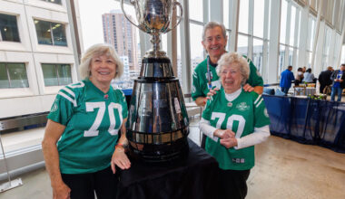 Former Saskatchewan Roughriders wide receiver, Steve Mazurak, with his wife Heather (left) and his 96-year-old mother-in-law, Brenda Thomson and the Grey Cup at the CFLAA Legends Luncheon Friday. (Mike Deal / Free Press)