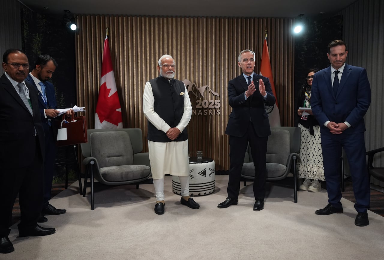 Canadian Prime Minister Mark Carney, centre right, speaks as Indian Prime Minister Narendra Modi before a meeting at the G7 Summit in Kananaskis, Alta., on Tuesday, June 17, 202