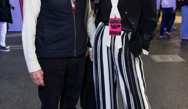 Catherine Zeta-Jones, 56, and husband Michael Douglas, 81, twinned in chic monochrome ensembles as the Wednesday actress opted to elongate her legs with bold striped trousers