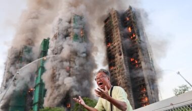 Hong Kong highrise fire leaves at least 13 dead, with reports of residents trapped