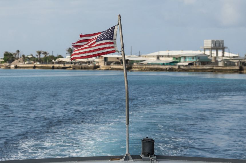 A US flag flutters as the US Army ferry to Kwajalein leaves Ebeye Dock, in Ebeye, Marshall Islands, June 16, 2025.