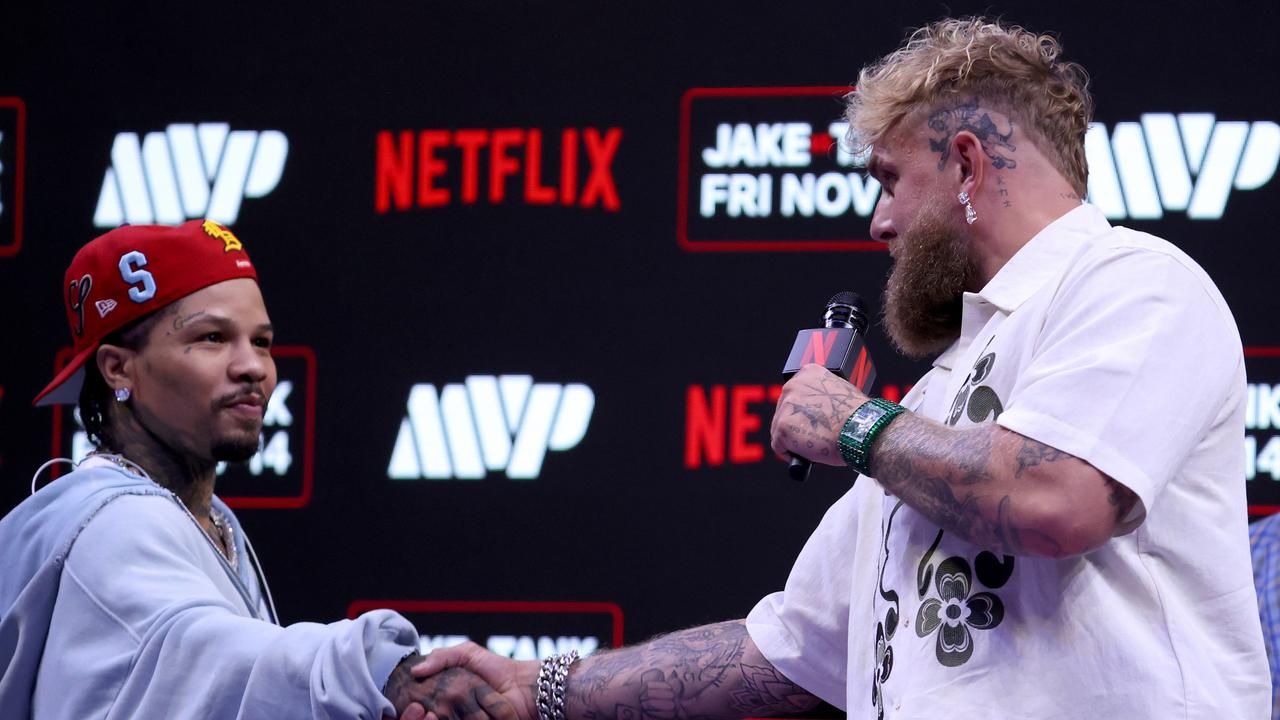MIAMI, FLORIDA - SEPTEMBER 23: Gervonta "Tank" Davis and Jake Paul shake hands at news conference for their exhibition match scheduled for November 14 at Kaseya Center on September 23, 2025 in Miami, Florida. (Photo by Leonardo Fernandez/Getty Images)