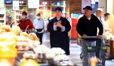 Consumers shop at a supermarket in Huaian, East China