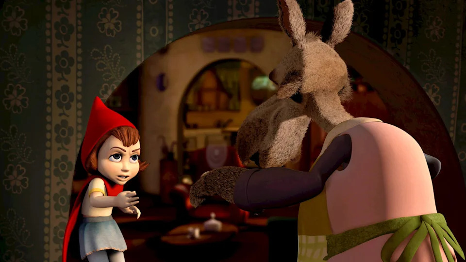 Animated Little Red Riding Hood confronts the Wolf, who is wearing an apron, inside a cozy house setting