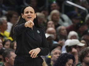 New York Liberty head coach Sandy Brondello points from the sideline during the first half of a WNBA basketball game against the Seattle Storm, Sunday, June 22, 2025, in Seattle.