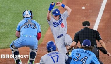 Los Angeles Dodgers catcher Will Smith slides in to score