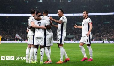 The England players celebrate together after Bukayo Saka's goal.