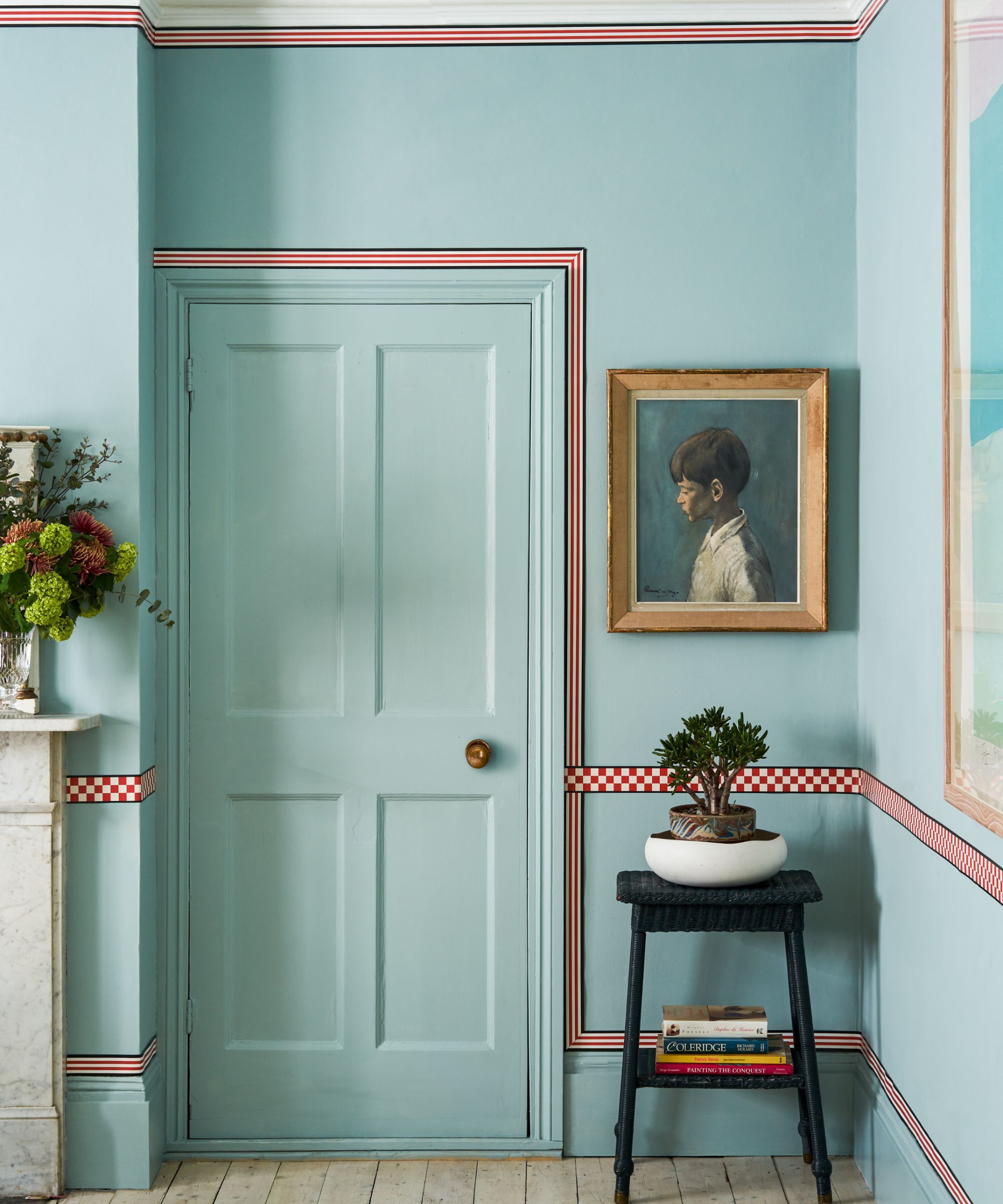 A doorway painted in bright turquoise