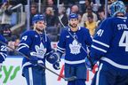 Toronto Maple Leafs' Scott Laughton (24) celebrates with his team after their win against the Utah Mammoth in NHL hockey action in Toronto, on Wednesday, Nov. 5, 2025. THE CANADIAN PRESS/Sammy Kogan