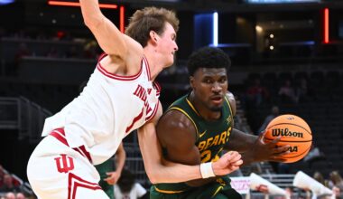 Baylor guard Tounde Yessoufou (right) advances the ball as Indiana forward Reed Bailey (left) defends in the second half of a game at Gainbridge Fieldhouse on Oct. 26 in Indianapolis.