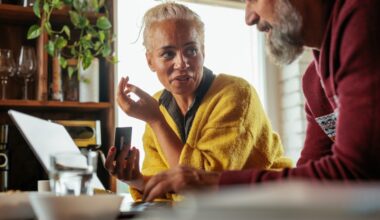 Middle aged couple discussing finances in their kitchen.jpg