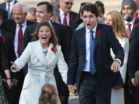 Sophie Gregoire (L) and Justin Trudeau react to seeing their children as the Liberal government is sworn in at Rideau Hall in 2015. (Wayne Cuddington/Postmedia)
