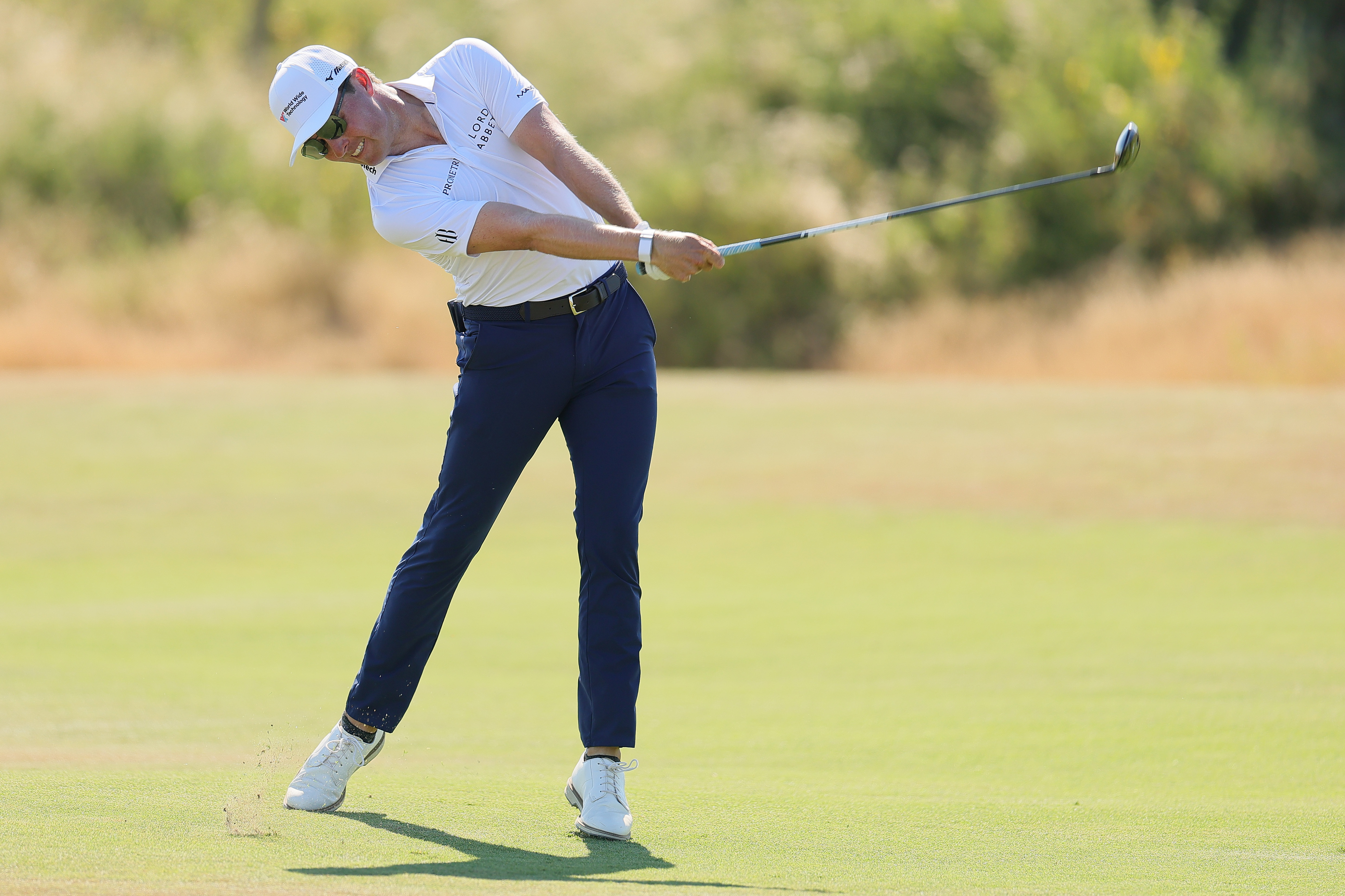 Ben Griffin hits a fairway wood off the fairway