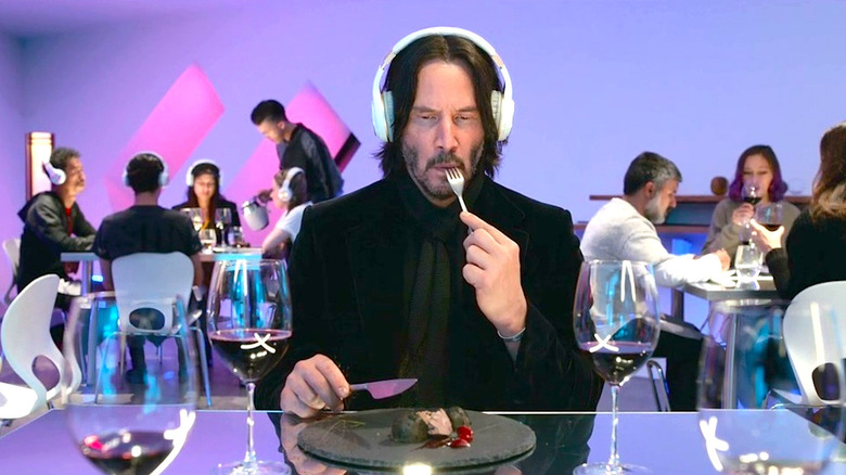 Keanu Reeves eat at a trendy restaurant while wearing headphones in Always Be My Maybe